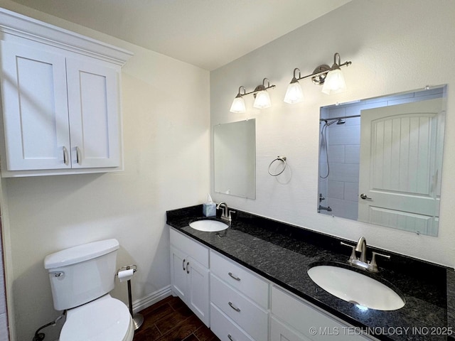 full bath with wood finished floors, toilet, a sink, and a shower