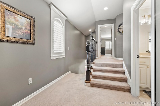 staircase with baseboards, carpet flooring, and recessed lighting