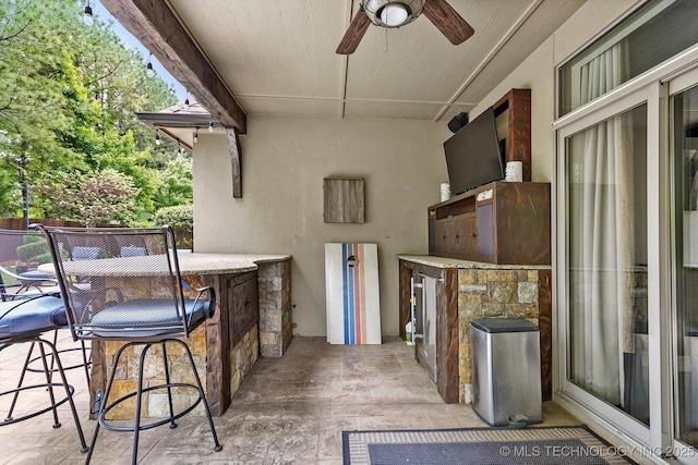 view of patio with a ceiling fan