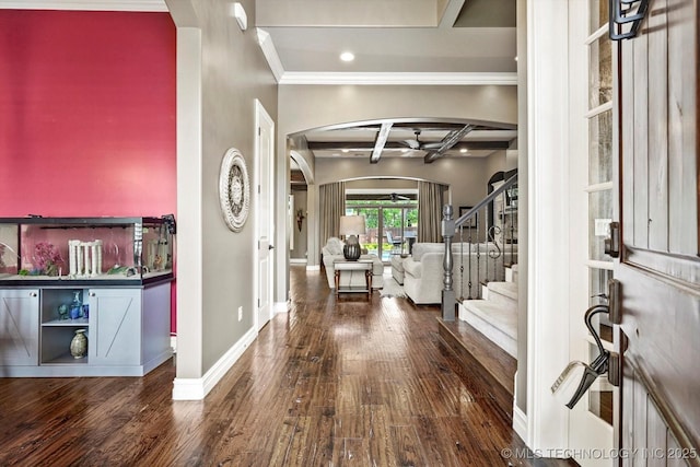 entrance foyer featuring arched walkways, baseboards, hardwood / wood-style flooring, and coffered ceiling