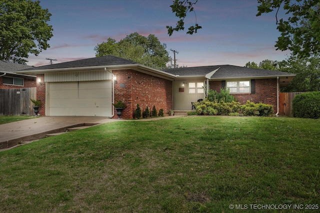 5729 E 25th Pl, Tulsa, OK 74114 - ranch-style home with brick siding, an attached garage, and fence