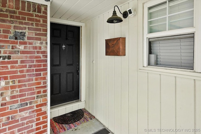5729 E 25th Pl, Tulsa, OK 74114 - doorway to property featuring a porch and brick siding
