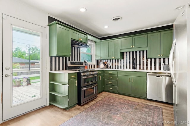 5729 E 25th Pl, Tulsa, OK 74114 - kitchen with visible vents, light countertops, green cabinetry, and stainless steel appliances