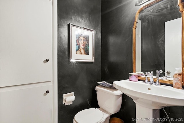 5729 E 25th Pl, Tulsa, OK 74114 - half bathroom with a sink and toilet