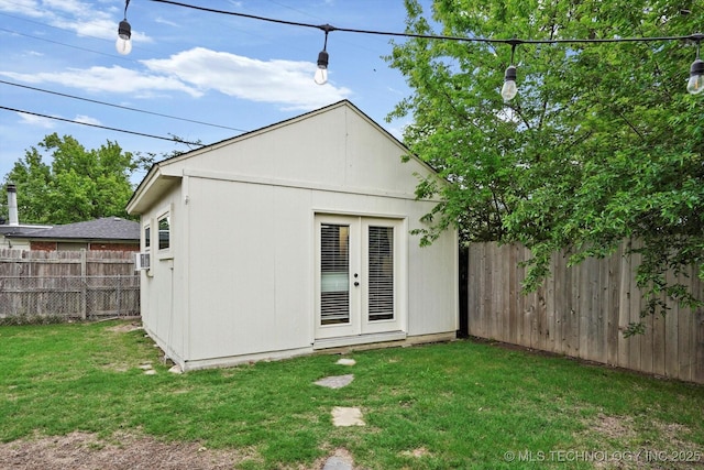 5729 E 25th Pl, Tulsa, OK 74114 - rear view of property with fence and a lawn