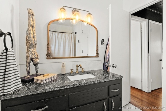 5729 E 25th Pl, Tulsa, OK 74114 - bathroom with vanity and wood finished floors