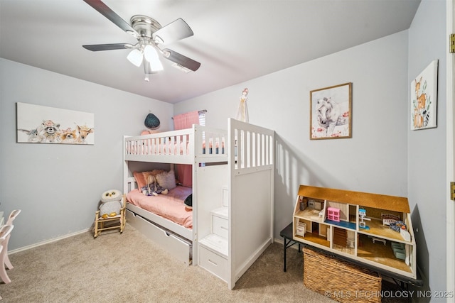 bedroom featuring baseboards, ceiling fan, and carpet
