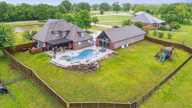 drone / aerial view with a water view