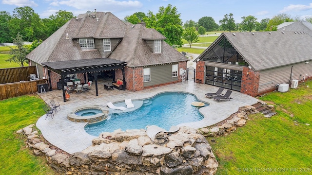 view of swimming pool with a pergola, a pool with connected hot tub, a fenced backyard, a lawn, and a patio