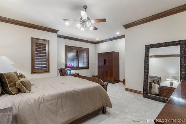 bedroom featuring crown molding, baseboards, light colored carpet, and ceiling fan