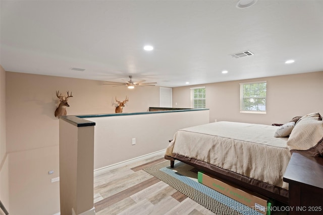 bedroom featuring recessed lighting, baseboards, visible vents, and light wood-style floors