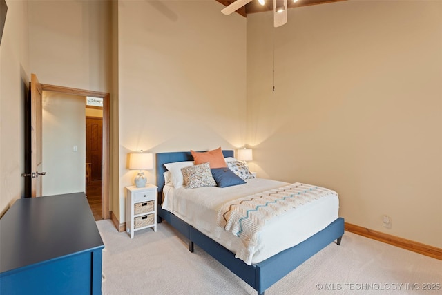 53402 E 332nd Loop, Jay, OK 74346 - bedroom with light carpet, a high ceiling, baseboards, and a ceiling fan