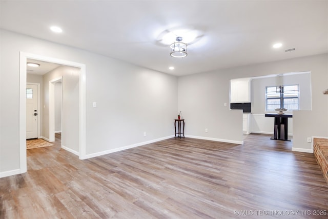 unfurnished living room featuring recessed lighting, visible vents, and light wood-style floors
