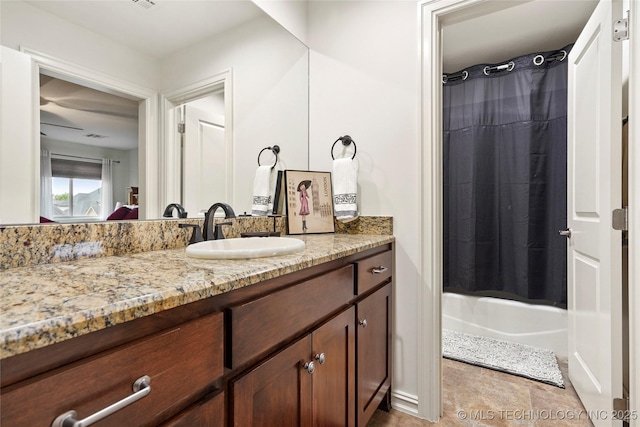 bathroom featuring vanity, shower / tub combo with curtain, and tile patterned floors
