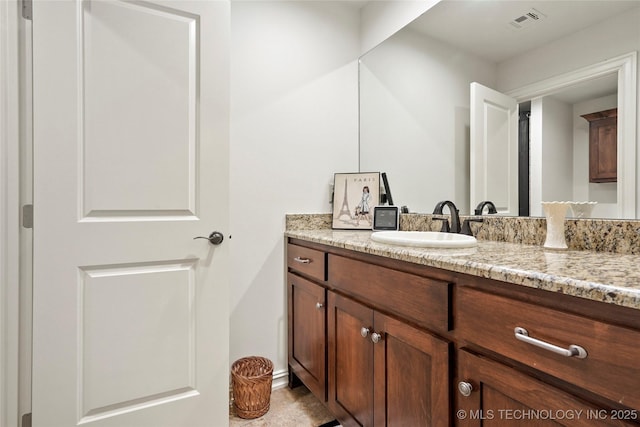 bathroom featuring vanity and visible vents