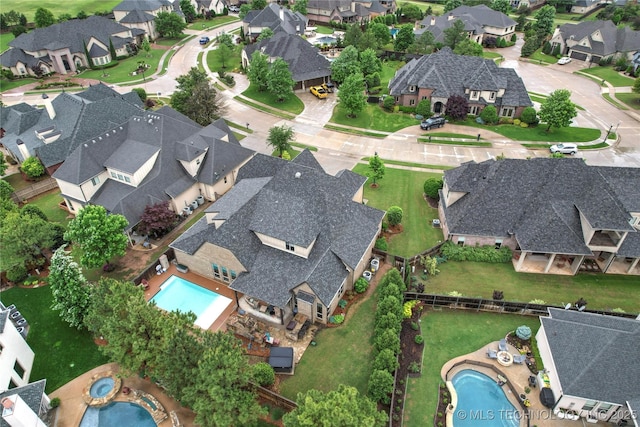 birds eye view of property with a residential view