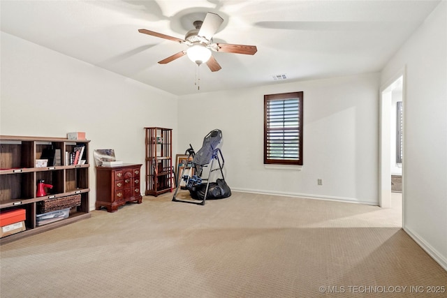 recreation room with carpet floors, a ceiling fan, baseboards, and visible vents