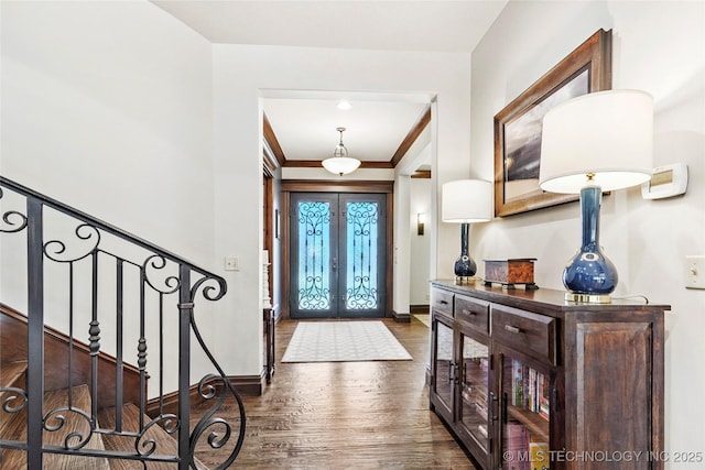 4401 S Quinoa Ave, Broken Arrow, OK 74011 - entryway with french doors, dark wood finished floors, stairway, and ornamental molding