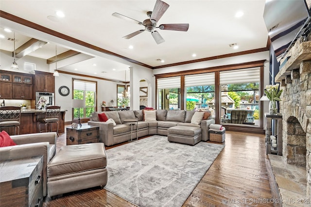 4401 S Quinoa Ave, Broken Arrow, OK 74011 - living area featuring ceiling fan, ornamental molding, a stone fireplace, wood finished floors, and recessed lighting