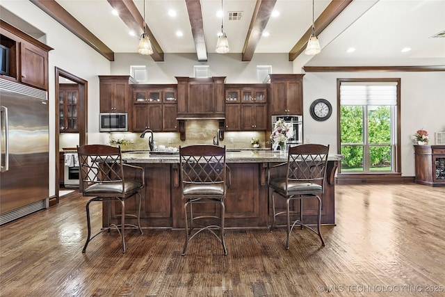 4401 S Quinoa Ave, Broken Arrow, OK 74011 - kitchen with stainless steel appliances, beamed ceiling, dark wood-style floors, backsplash, and a large island