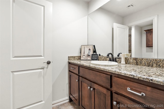 4401 S Quinoa Ave, Broken Arrow, OK 74011 - bathroom featuring vanity and baseboards