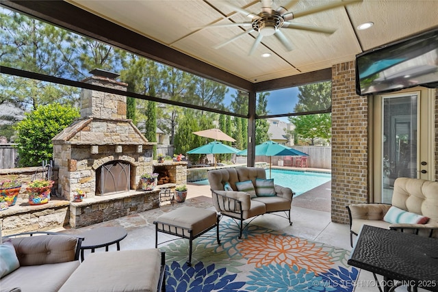 4401 S Quinoa Ave, Broken Arrow, OK 74011 - fenced backyard with a ceiling fan, an outdoor living space with a fireplace, and a patio