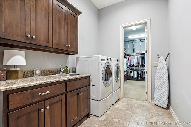 4401 S Quinoa Ave, Broken Arrow, OK 74011 - washroom featuring washing machine and dryer, cabinet space, and light colored carpet