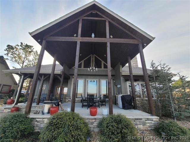 180 Channel Rd, Eufaula, OK 74432 - back of property with a patio area
