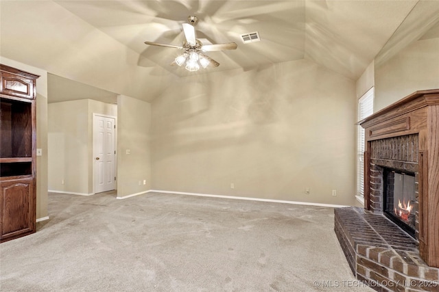 unfurnished living room featuring visible vents, lofted ceiling, a fireplace, light carpet, and a ceiling fan
