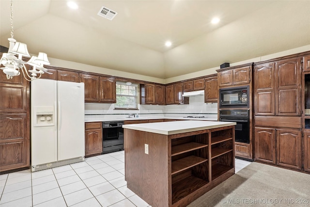 kitchen with open shelves, light countertops, vaulted ceiling, visible vents, and black appliances