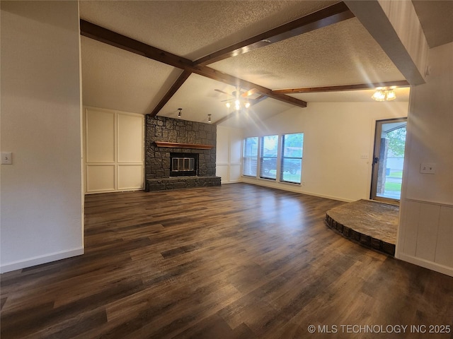 unfurnished living room with a fireplace, a ceiling fan, a textured ceiling, and dark wood-type flooring