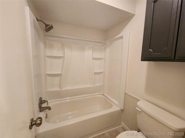bathroom with shower / bathtub combination and toilet