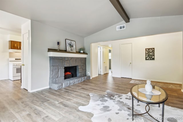 6727 S Richmond Ave Unit 632, Tulsa, OK 74136 - unfurnished living room with wood finished floors, a stone fireplace, and baseboards
