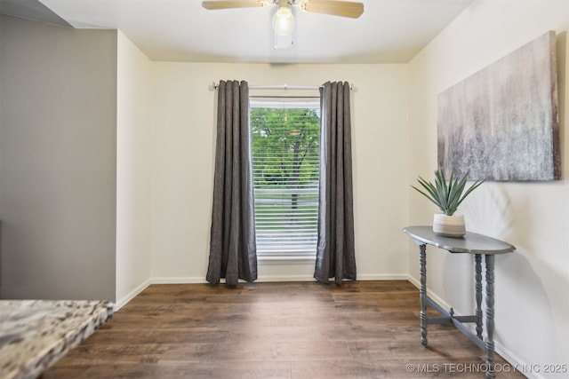 6727 S Richmond Ave Unit 632, Tulsa, OK 74136 - spare room featuring wood finished floors, a ceiling fan, and baseboards