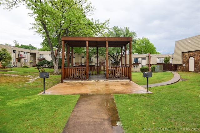 6727 S Richmond Ave Unit 632, Tulsa, OK 74136 - view of grassy yard featuring a patio