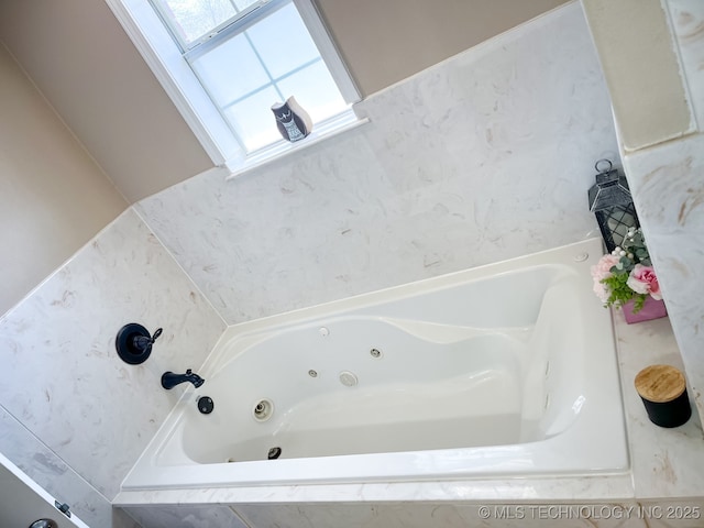 full bath featuring a whirlpool tub