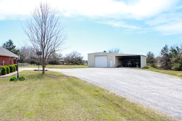 exterior space with a pole building and gravel driveway