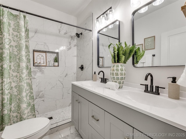 bathroom with a sink, marble finish floor, a shower with shower curtain, and toilet
