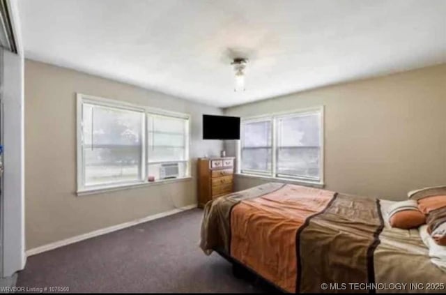 bedroom with baseboards, carpet, and cooling unit