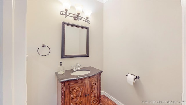 bathroom with vanity and baseboards