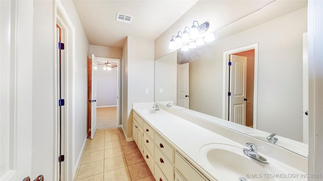 bathroom featuring visible vents, a sink, tile patterned flooring, and double vanity