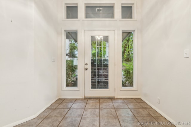 1491 Southpointe Rd, Eucha, OK 74342 - doorway featuring baseboards and light tile patterned floors