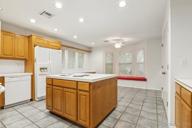 kitchen featuring ceiling fan, visible vents, light countertops, recessed lighting, and white appliances