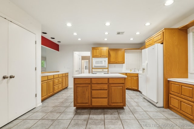 1491 Southpointe Rd, Eucha, OK 74342 - kitchen with light tile patterned floors, light countertops, white appliances, and visible vents