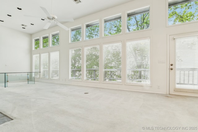 unfurnished sunroom with visible vents