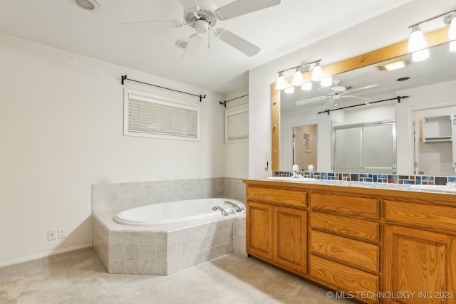 full bath featuring vanity, a ceiling fan, a garden tub, and a stall shower