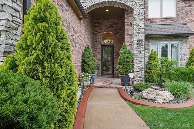 property entrance with brick siding