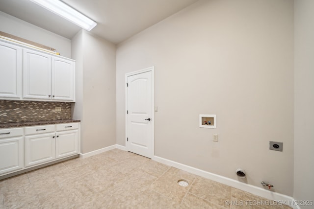 laundry area with cabinet space, washer hookup, hookup for a gas dryer, baseboards, and electric dryer hookup