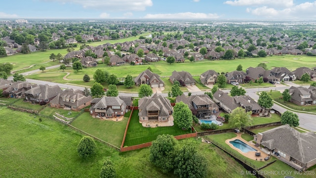 bird's eye view with golf course view and a residential view