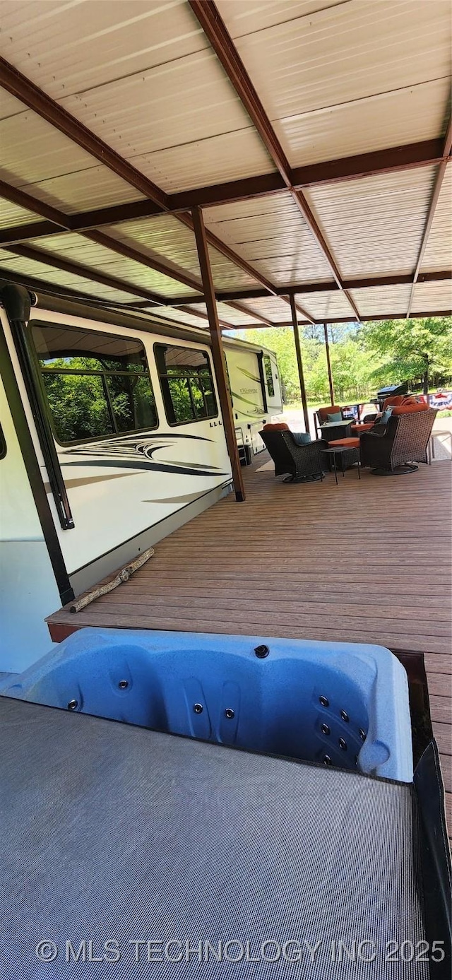 view of patio with a wooden deck and outdoor lounge area